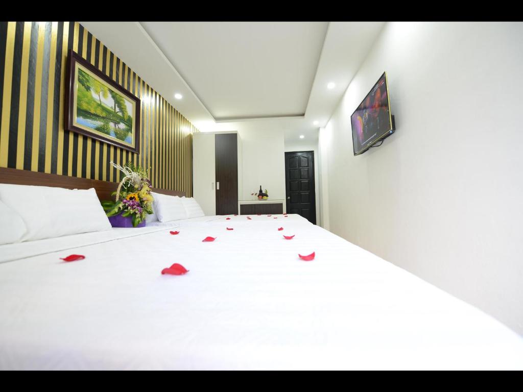 Postel nebo postele na pokoji v ubytování Hanoi Golden Hostel