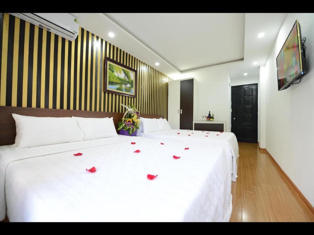 Postel nebo postele na pokoji v ubytování Hanoi Golden Hostel