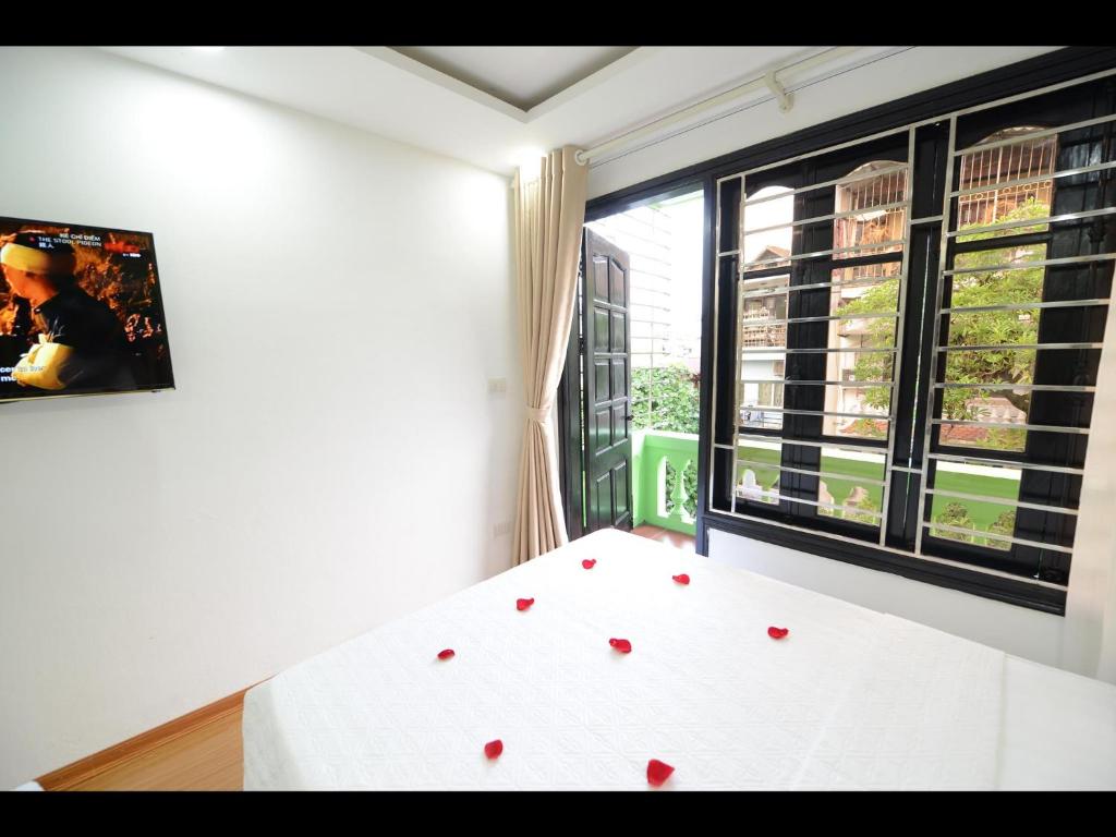 Postel nebo postele na pokoji v ubytování Hanoi Golden Hostel