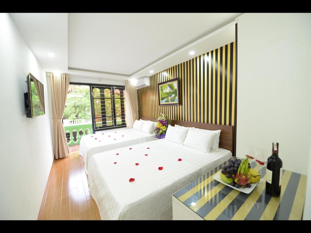 Postel nebo postele na pokoji v ubytování Hanoi Golden Hostel