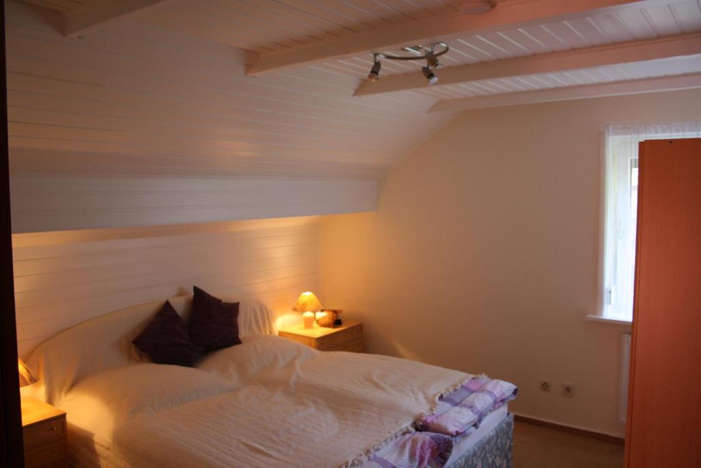 Postel nebo postele na pokoji v ubytování Haus Schwalbennest