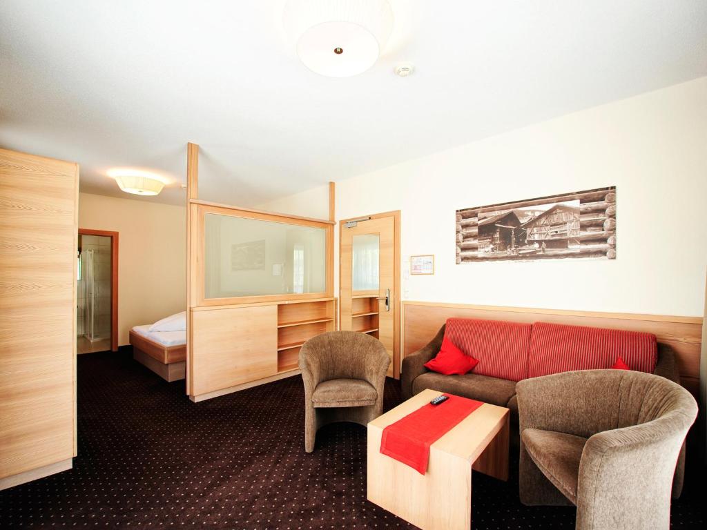 Postel nebo postele na pokoji v ubytování Hotel Röck Garni