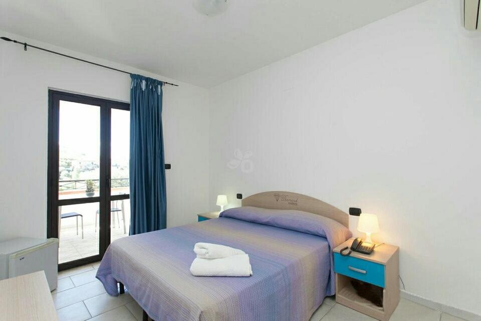 Postel nebo postele na pokoji v ubytování Hotel Diamond Residence