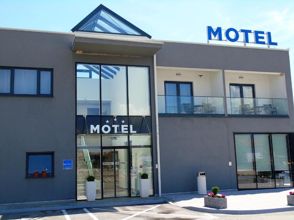a store front of a motel with a sign on it at Motel Kamenica in Bihać