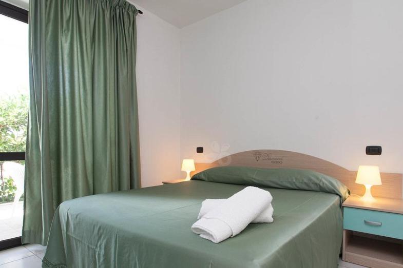Postel nebo postele na pokoji v ubytování Hotel Diamond Residence