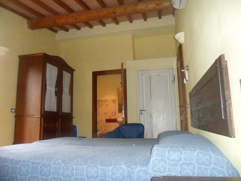Łóżko lub łóżka w pokoju w obiekcie Agritur Villa Osvaldo Castiglione del Lago Perugia Colazione Piscina acqua salata