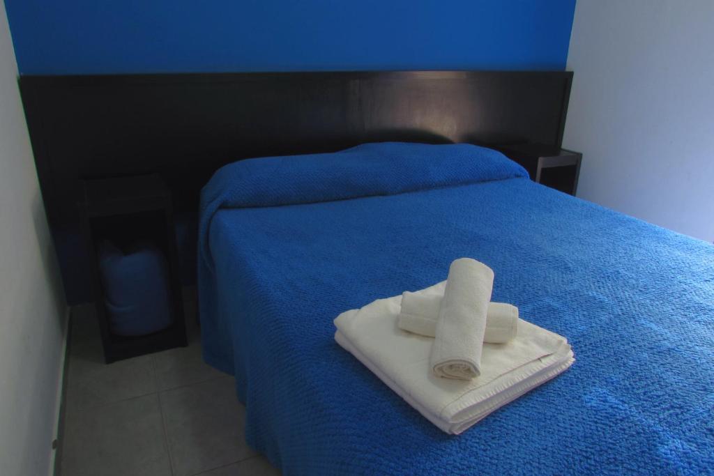 Postel nebo postele na pokoji v ubytování Hostel de los Colores