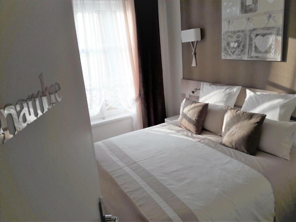 Postel nebo postele na pokoji v ubytování Chic En Ville