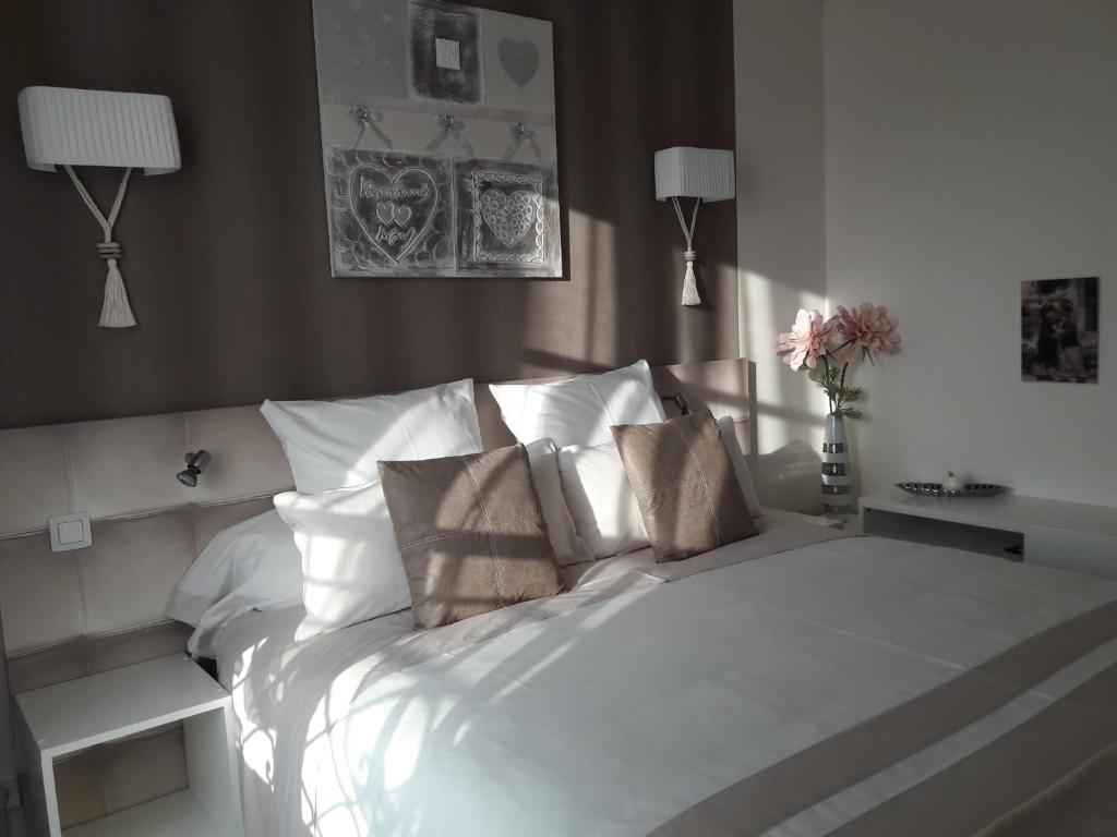 Postel nebo postele na pokoji v ubytování Chic En Ville