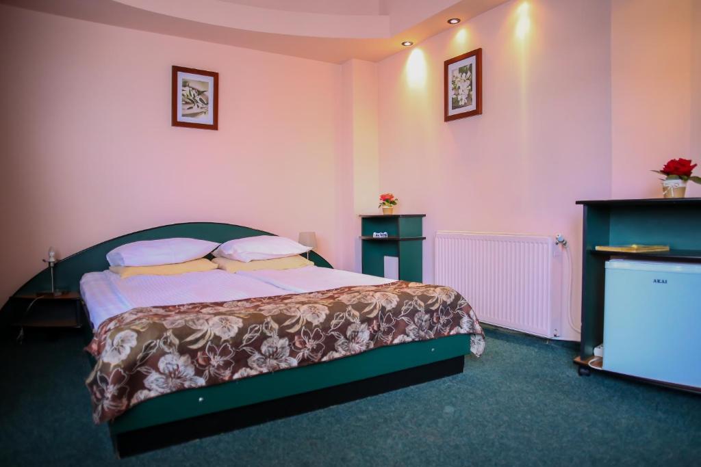 Postel nebo postele na pokoji v ubytování Hotel Silva