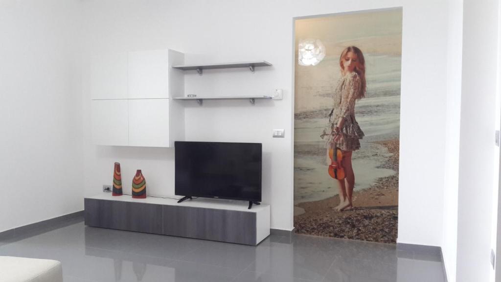 TV a/nebo společenská místnost v ubytování residence Giulia
