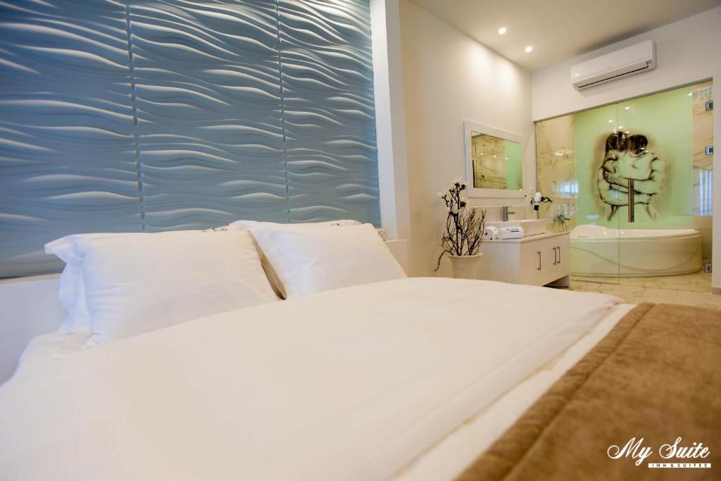 Postel nebo postele na pokoji v ubytování My Suite Boutique Hotel