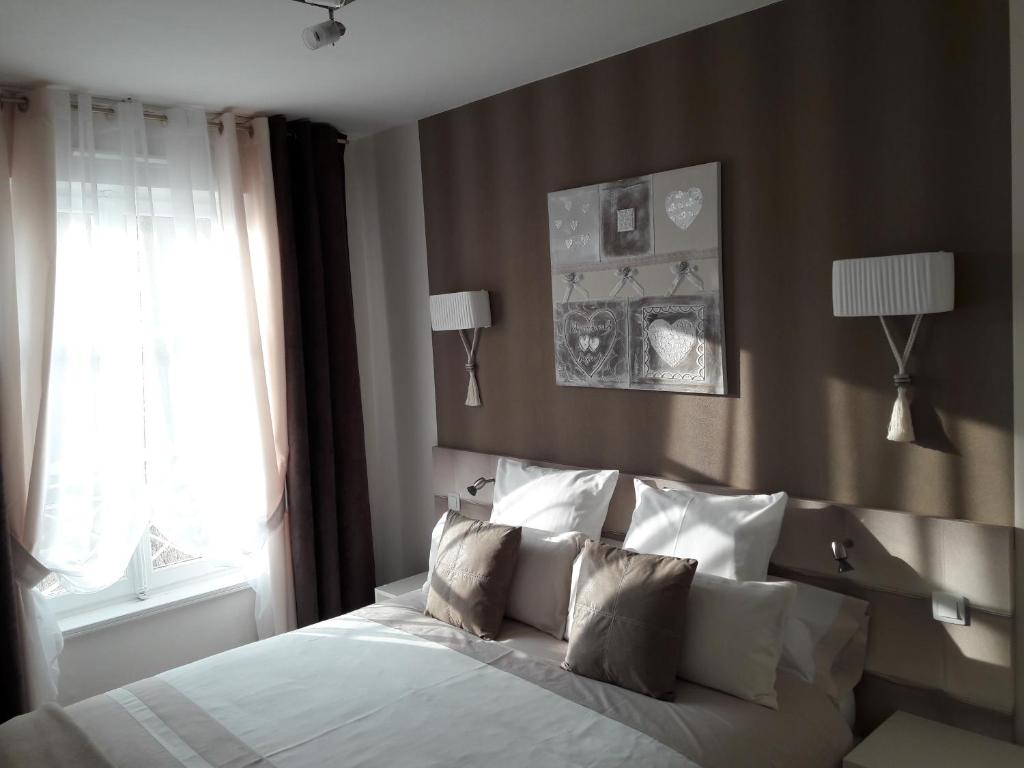 Postel nebo postele na pokoji v ubytování Chic En Ville