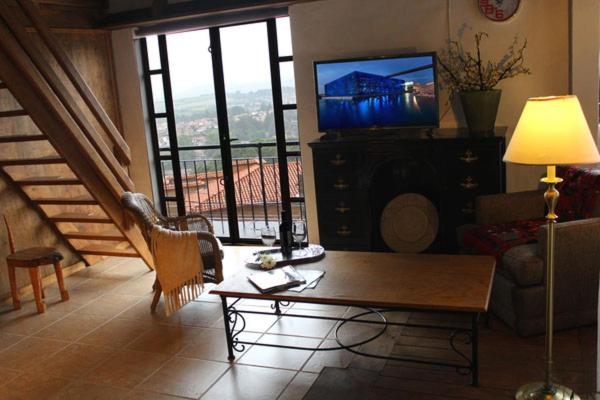 TV a/nebo společenská místnost v ubytování Hotel Villa Cassis