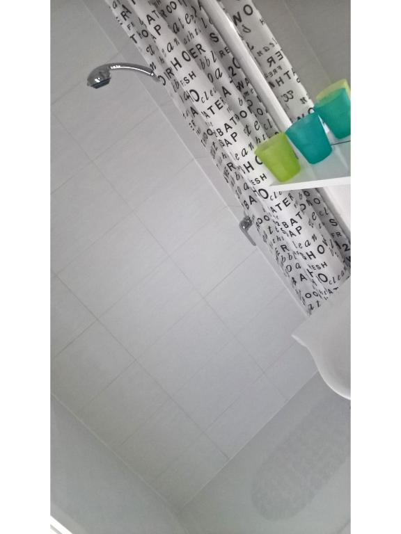 a shower curtain in a bathroom at San Eleuterio Guesthouse in Poreč