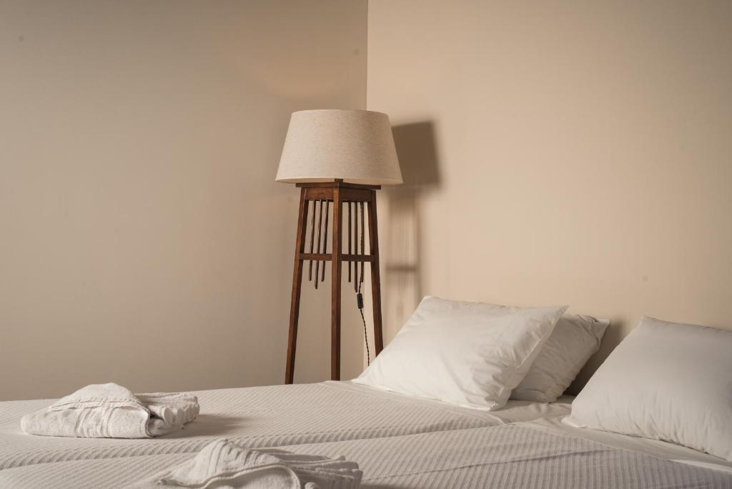 Un ou plusieurs lits dans un hébergement de l'établissement Nonnalena Boutique Hotel