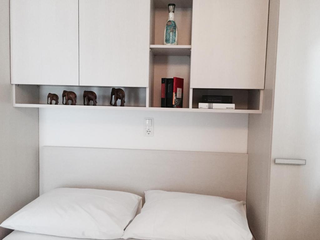 Posteľ alebo postele v izbe v ubytovaní Apartments Leptiric