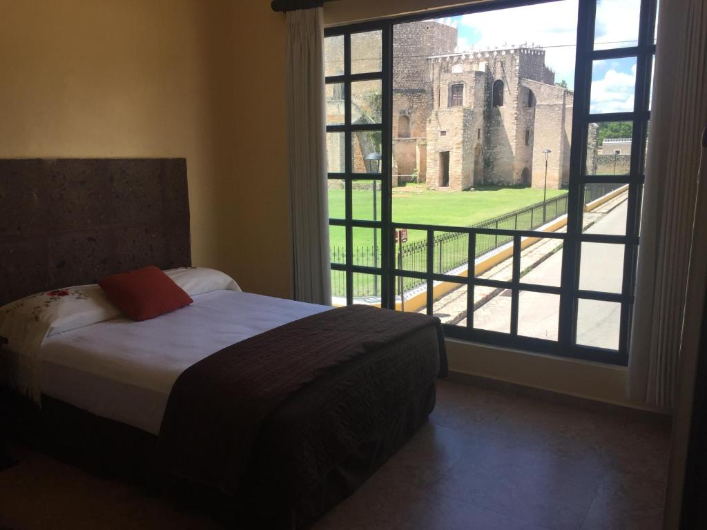 Postel nebo postele na pokoji v ubytování Hotel Rinconada del Convento