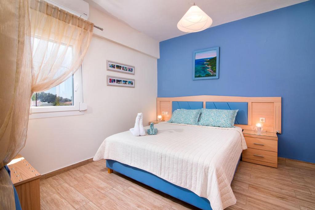 Posteľ alebo postele v izbe v ubytovaní Olive Garden Villas and Apartments