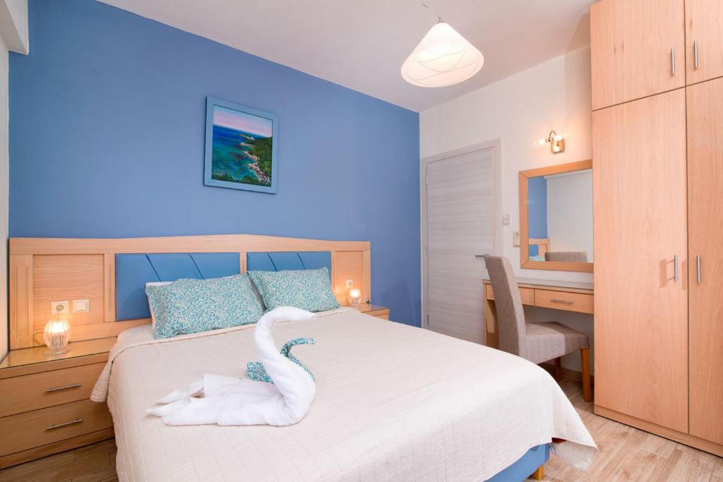 Posteľ alebo postele v izbe v ubytovaní Olive Garden Villas and Apartments