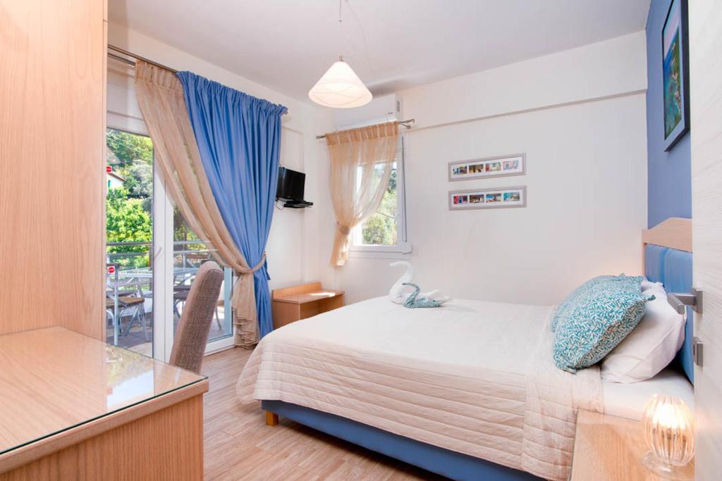 Posteľ alebo postele v izbe v ubytovaní Olive Garden Villas and Apartments