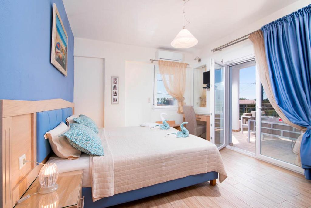 Posteľ alebo postele v izbe v ubytovaní Olive Garden Villas and Apartments