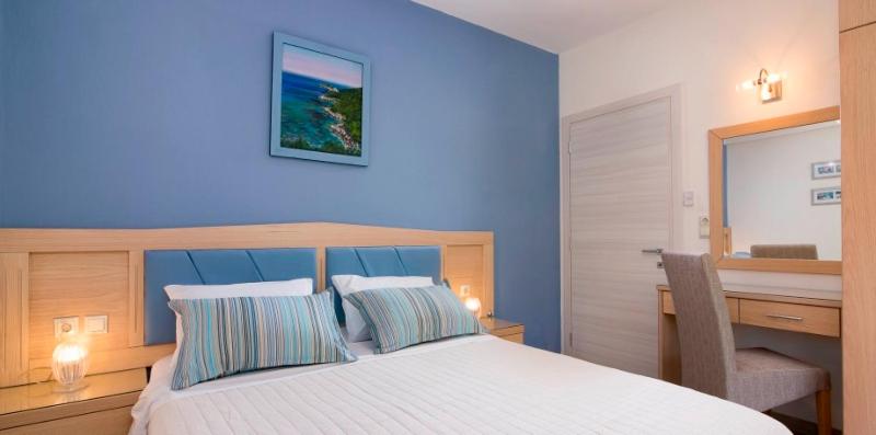 Posteľ alebo postele v izbe v ubytovaní Olive Garden Villas and Apartments