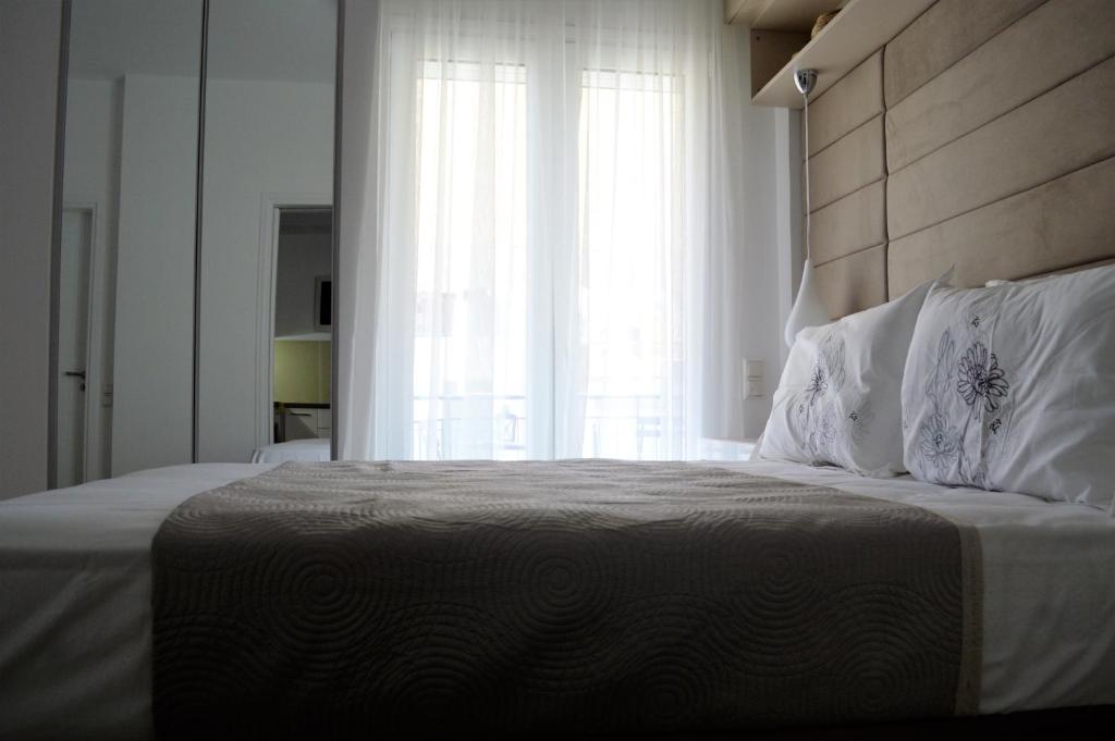 Postel nebo postele na pokoji v ubytování Athens Nest