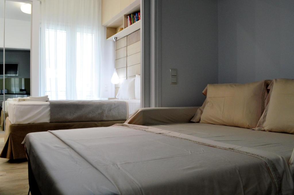 Postel nebo postele na pokoji v ubytování Athens Nest
