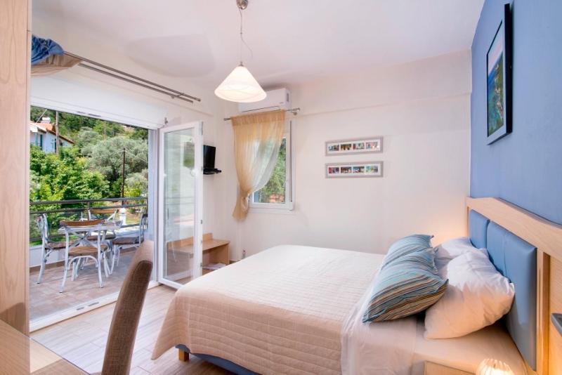 Posteľ alebo postele v izbe v ubytovaní Olive Garden Villas and Apartments
