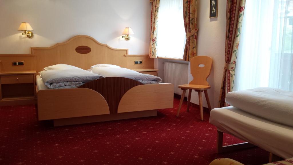 Postel nebo postele na pokoji v ubytování Garni Rubens B&B