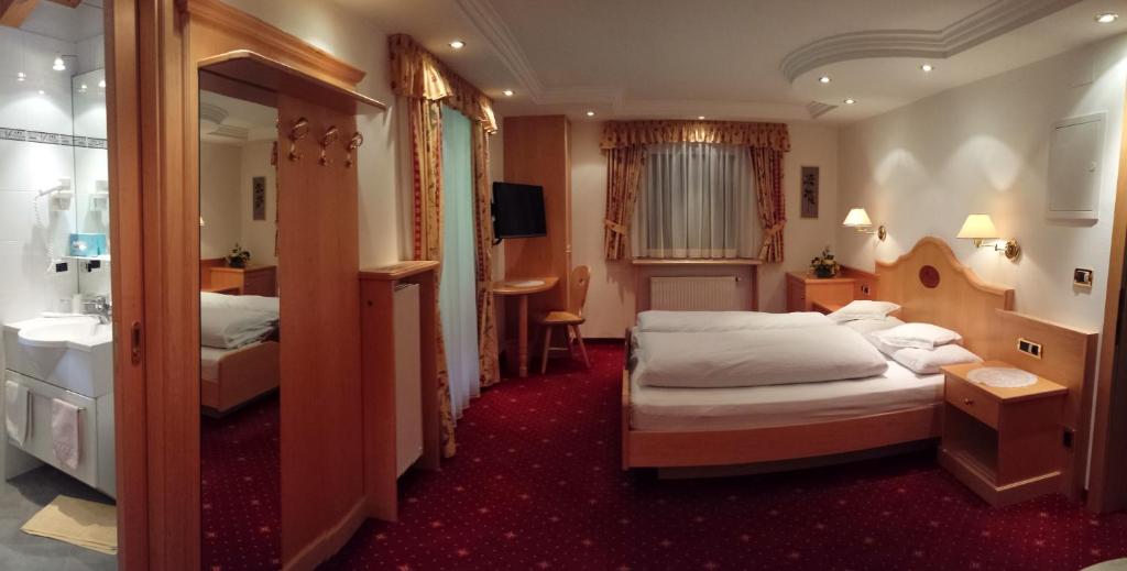 Postel nebo postele na pokoji v ubytování Garni Rubens B&B