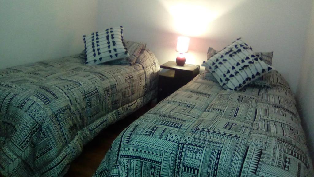 Postel nebo postele na pokoji v ubytování Casa En La Precordillera