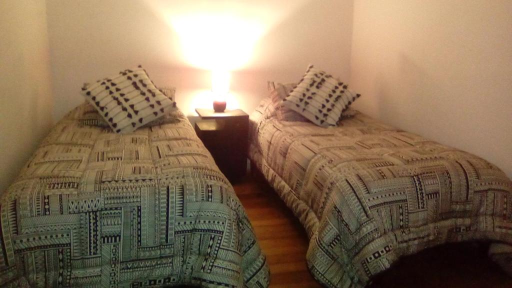 Postel nebo postele na pokoji v ubytování Casa En La Precordillera
