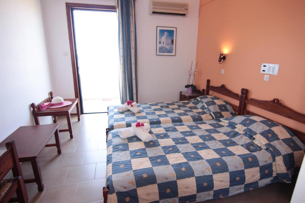 Postel nebo postele na pokoji v ubytování Lofos Hotel