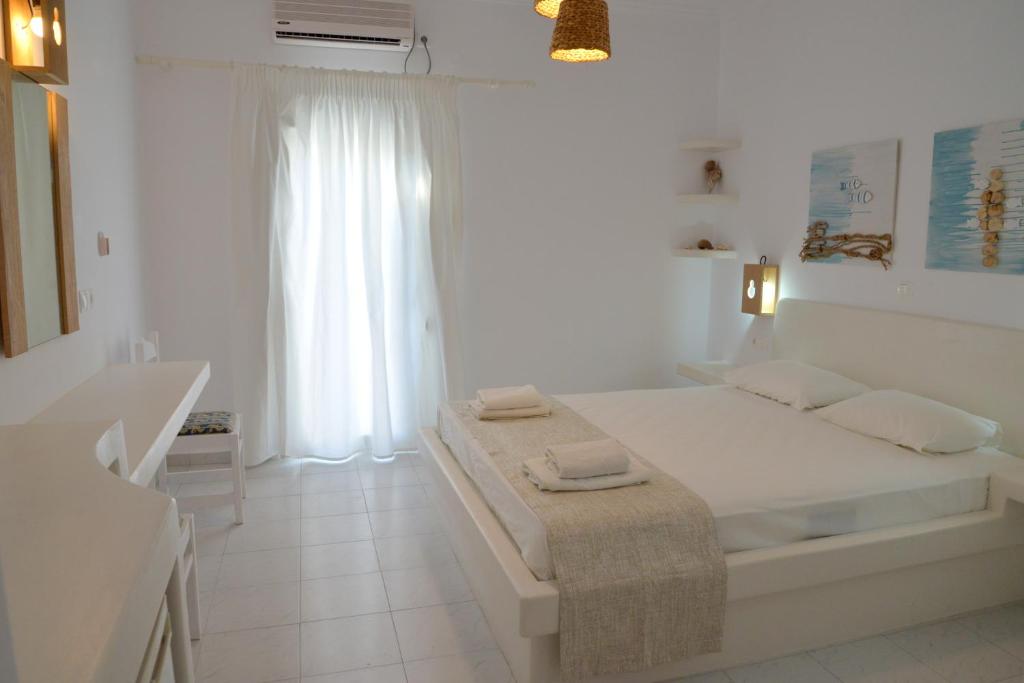 Postel nebo postele na pokoji v ubytování Corali Hotel
