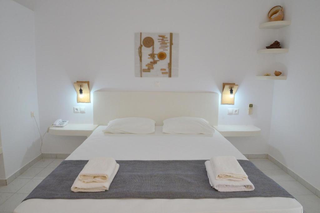Postel nebo postele na pokoji v ubytování Corali Hotel
