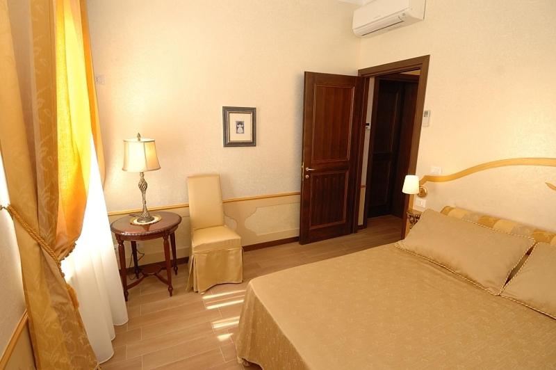 A bed or beds in a room at Corte dei Santi