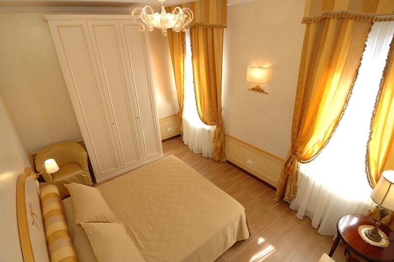 A bed or beds in a room at Corte dei Santi