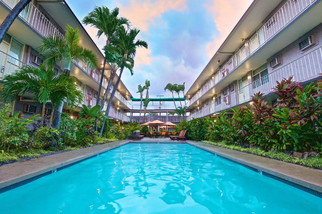 a swimming pool in the middle of a building at Pacific Marina Inn in Honolulu