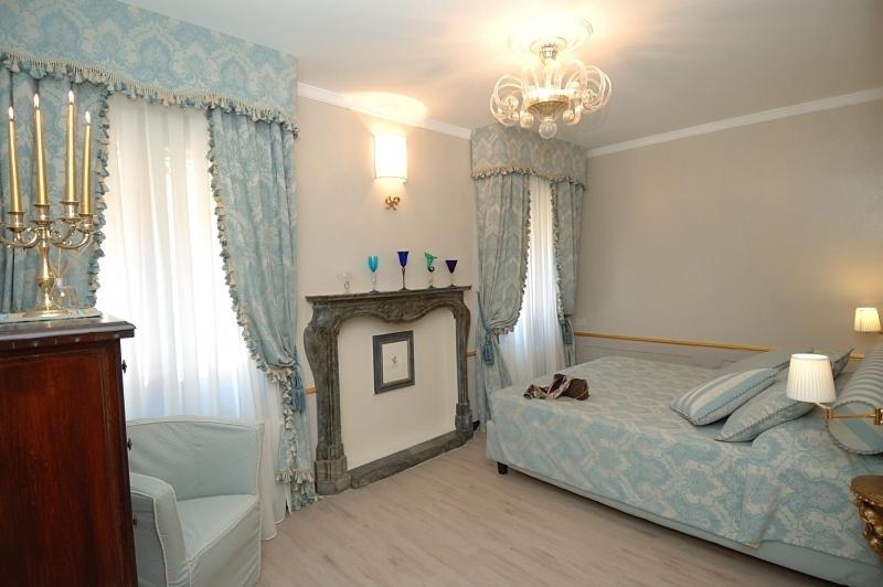 A bed or beds in a room at Corte dei Santi