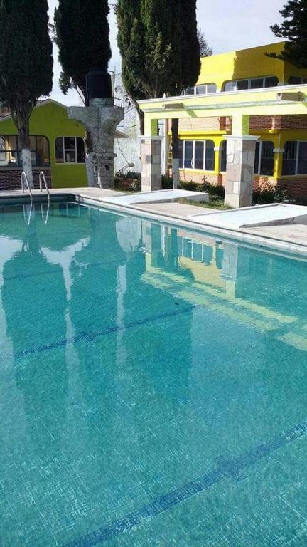 Bazén v ubytování Hotel Cipreses nebo v jeho okolí