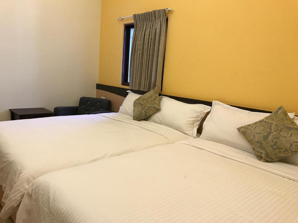 Postel nebo postele na pokoji v ubytování Lucky Bear Guesthouse