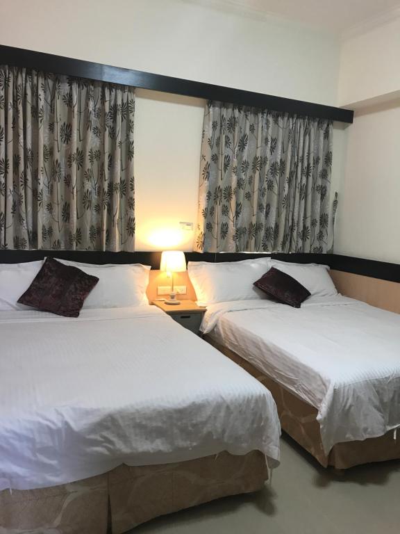 Postel nebo postele na pokoji v ubytování Lucky Bear Guesthouse