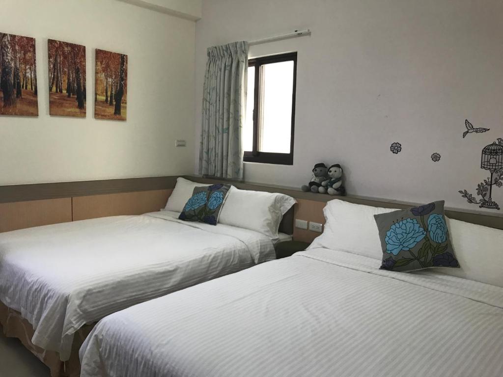 Postel nebo postele na pokoji v ubytování Lucky Bear Guesthouse