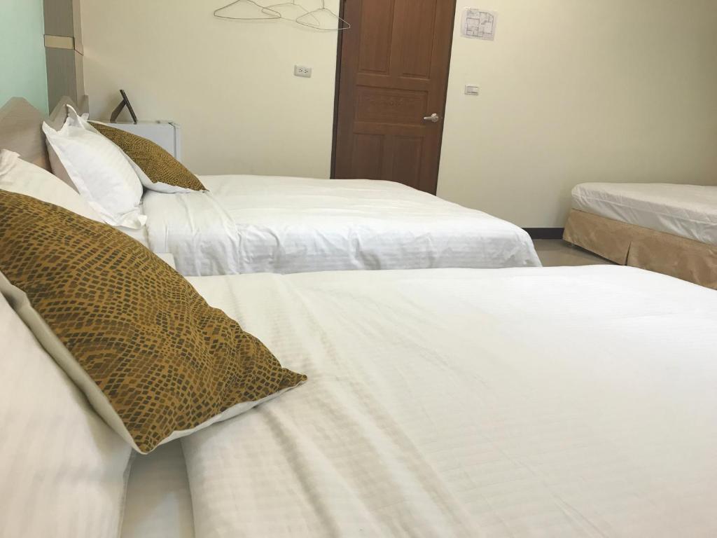 Postel nebo postele na pokoji v ubytování Lucky Bear Guesthouse