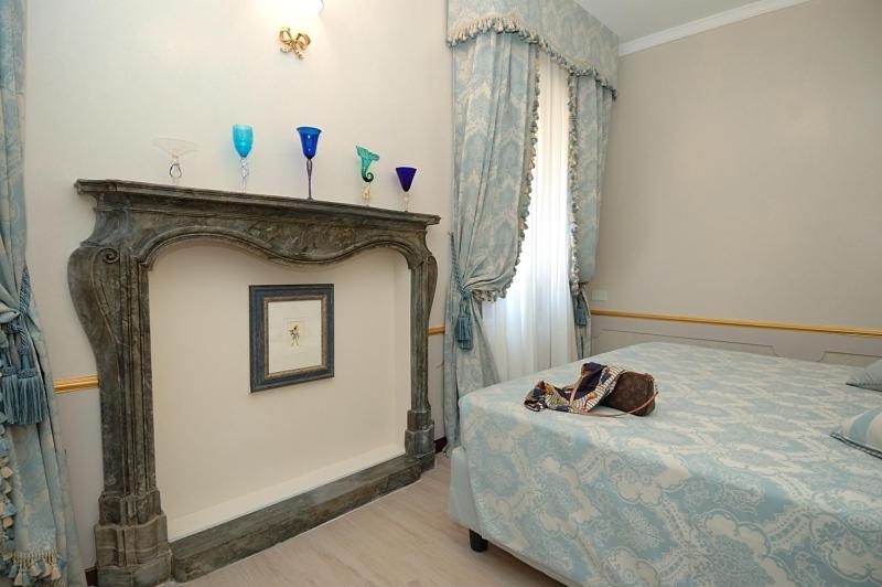 A bed or beds in a room at Corte dei Santi