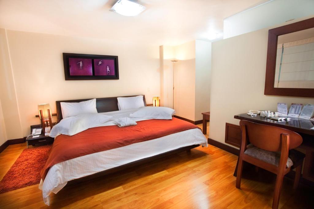 Postel nebo postele na pokoji v ubytování Loft Hotel