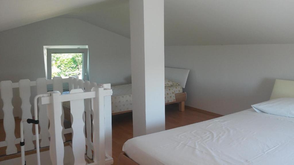 Postel nebo postele na pokoji v ubytování House Barizoni