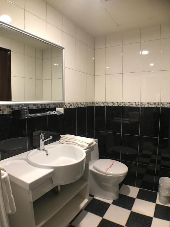 Koupelna v ubytování Kaishen Hotel